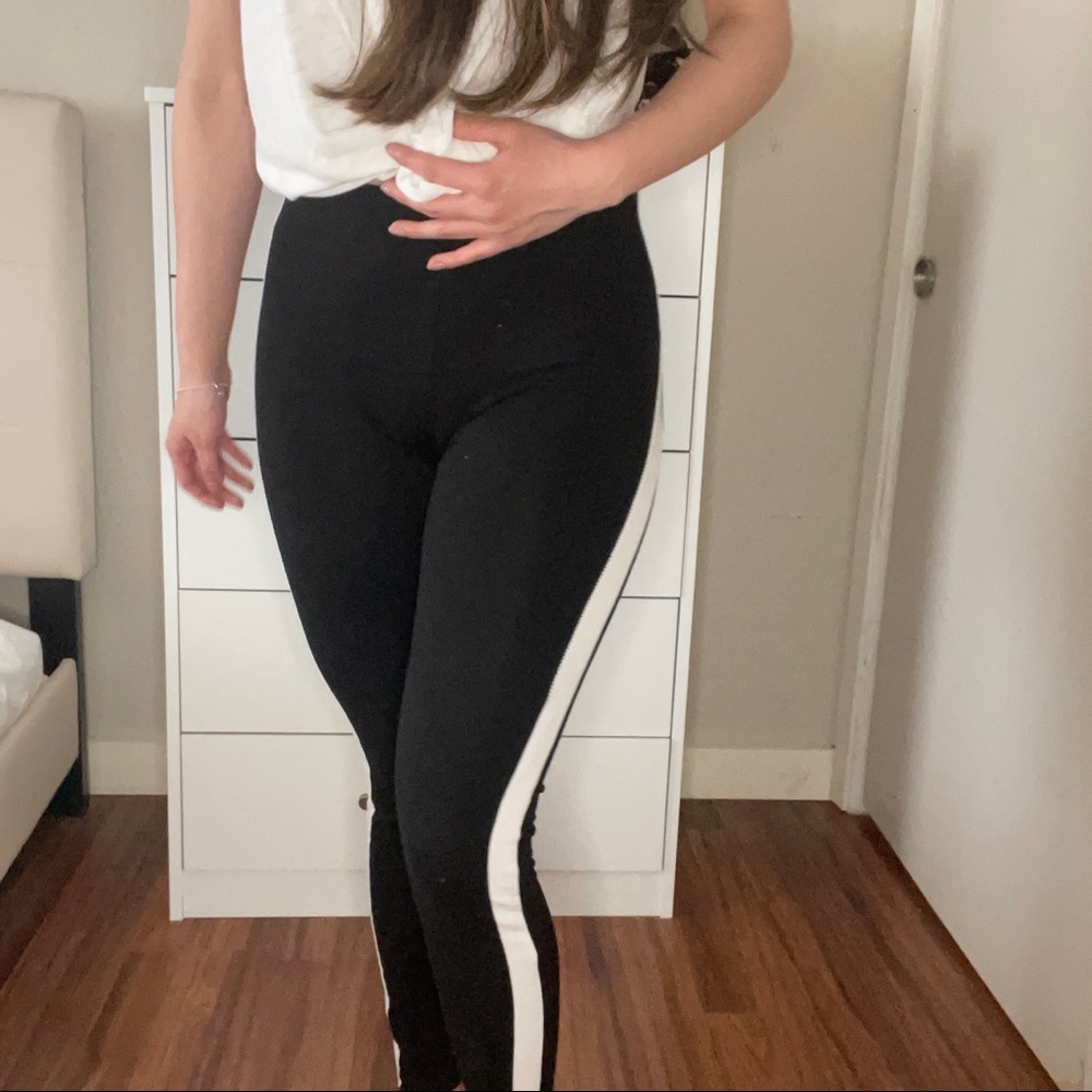 Black leggings with white stripe